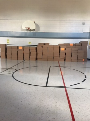 boxes of crayons stacked in school gymnasium