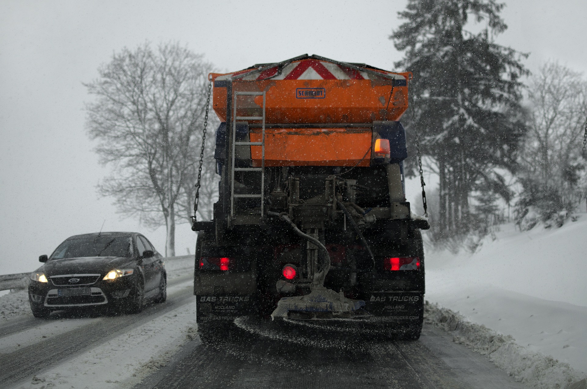 Truck plowing snow in a storm